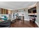 Inviting living room with hardwood floors, modern lighting and decorative shelving at 5477 E Asbury Ave, Denver, CO 80222