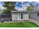 Backyard storage shed with new siding, adjacent to trampoline at 5477 E Asbury Ave, Denver, CO 80222