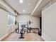 Finished basement featuring workout area with weight bench and punching bag at 19431 E Hamilton Pl, Aurora, CO 80013