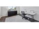 Versatile room with dark floors and a sewing station next to a window at 19431 E Hamilton Pl, Aurora, CO 80013