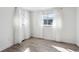 Bright bedroom with wood floors, sheer curtains and multiple windows for natural light at 19431 E Hamilton Pl, Aurora, CO 80013