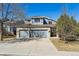 Charming two-story home with a brick facade and a spacious three-car garage, perfect for a growing Gathering at 19431 E Hamilton Pl, Aurora, CO 80013