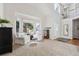 Spacious living room with large windows, plush seating, and a cozy atmosphere, perfect for relaxation at 19431 E Hamilton Pl, Aurora, CO 80013