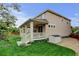 Exterior view of a home featuring a covered porch and a storage shed at 2454 Ambience Ln, Castle Rock, CO 80109