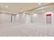 Large finished basement provides plenty of space for activities and storage, with neutral carpeting and recessed lighting at 2454 Ambience Ln, Castle Rock, CO 80109