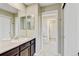 Bathroom featuring double mirrors, a spacious vanity, and a tile floor at 2454 Ambience Ln, Castle Rock, CO 80109