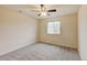 Neutral bedroom featuring carpeted floors, a ceiling fan, and a window letting in natural light at 2454 Ambience Ln, Castle Rock, CO 80109