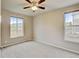 Bright, carpeted bedroom with dual windows and a ceiling fan provides a comfortable and inviting atmosphere at 2454 Ambience Ln, Castle Rock, CO 80109