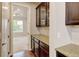 Butler's pantry with wooden cabinets and stone countertops, offering storage and serving space at 2454 Ambience Ln, Castle Rock, CO 80109