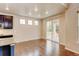 Bright dining area with hardwood floors, natural light, and sliding doors to the outdoor space at 2454 Ambience Ln, Castle Rock, CO 80109