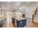 Modern kitchen with a center island, stainless appliances and an open floor plan at 2454 Ambience Ln, Castle Rock, CO 80109