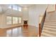 Spacious living room features high ceilings, hardwood floors, and a cozy fireplace at 2454 Ambience Ln, Castle Rock, CO 80109