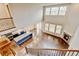 Open floor plan with hardwood, fireplace, kitchen island, and great natural light at 2454 Ambience Ln, Castle Rock, CO 80109