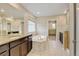 Beautiful main bathroom featuring a soaking tub, walk-in shower, dual sinks and neutral color palette at 2454 Ambience Ln, Castle Rock, CO 80109