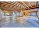 Unfinished basement showing the beams, ductwork, and plumbing, with a concrete floor and bare walls at 7472 Iridium Way, Castle Rock, CO 80108