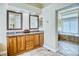 Bathroom features double sinks, granite countertops, and access to a soaking tub and shower at 7472 Iridium Way, Castle Rock, CO 80108