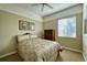 Cozy carpeted bedroom with neutral walls, a window for natural light and dresser for storage at 7472 Iridium Way, Castle Rock, CO 80108