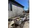 Exterior shot of a house featuring a gray exterior and a well-kept garden area with raised garden beds at 7472 Iridium Way, Castle Rock, CO 80108