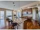 Eat-in kitchen featuring an island with granite countertops and stainless steel appliances at 7472 Iridium Way, Castle Rock, CO 80108