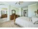 Spacious bedroom boasts carpet floors, ceiling fan, and a connecting bathroom with double sinks at 7472 Iridium Way, Castle Rock, CO 80108