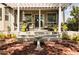 Charming outdoor patio featuring comfortable seating, a dining area, and lush landscaping for relaxed entertaining at 7472 Iridium Way, Castle Rock, CO 80108