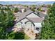 Aerial shot showing a well-maintained backyard with a covered patio and lush landscaping, creating a private oasis at 7472 Iridium Way, Castle Rock, CO 80108