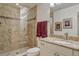 Modern bathroom featuring a glass-enclosed shower, granite vanity, and stylish decor at 9316 E Harvard Ave, Denver, CO 80231