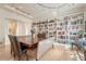 Elegant dining room featuring custom built-in shelving and modern lighting fixtures at 9316 E Harvard Ave, Denver, CO 80231