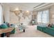 Relaxing living room with comfortable seating, a world map mural, and natural light at 9316 E Harvard Ave, Denver, CO 80231