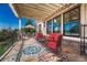 Spacious outdoor patio featuring a pergola, stylish seating, and views of the lush landscape at 9316 E Harvard Ave, Denver, CO 80231