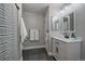 Updated bathroom featuring a white vanity, modern fixtures, and a stylish shower curtain at 6705 S Field St # 801, Littleton, CO 80128