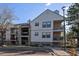 Exterior view of a multi-story condominium building with balconies and well-maintained landscaping at 6705 S Field St # 801, Littleton, CO 80128