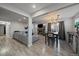 Open concept living space featuring a dining area, fireplace, and neutral color palette at 6705 S Field St # 801, Littleton, CO 80128