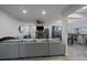 Bright living room featuring a stone fireplace, sleek decor, and seamless flow into the dining area at 6705 S Field St # 801, Littleton, CO 80128