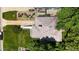 Aerial view of the house with its roof, and a well-maintained yard and landscaped surroundings at 2626 N Steele St, Denver, CO 80205