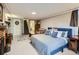 Finished basement bedroom with fireplace, sitting area and decoratively appointed with accent furniture at 2626 N Steele St, Denver, CO 80205