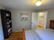 Comfortable bedroom featuring hardwood floors and ample storage space at 2626 N Steele St, Denver, CO 80205