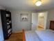 Comfortable bedroom featuring hardwood floors and ample storage space at 2626 N Steele St, Denver, CO 80205