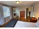 Bright bedroom featuring hardwood floors and a large window at 2626 N Steele St, Denver, CO 80205
