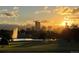 Beautiful sunrise over the city skyline and lake, creating a picturesque and inviting atmosphere at 2626 N Steele St, Denver, CO 80205