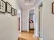 Hallway features hardwood floors, storage, and access to bedrooms in a home for sale at 2626 N Steele St, Denver, CO 80205