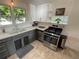 Updated kitchen with stainless steel appliances and ample counter space at 2626 N Steele St, Denver, CO 80205