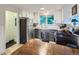 Well-equipped kitchen with stainless steel appliances, ample cabinet space, and a casual dining area at 2626 N Steele St, Denver, CO 80205