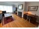 Inviting living room featuring a fireplace, hardwood floors, and a comfortable seating area at 2626 N Steele St, Denver, CO 80205