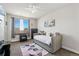 Cozy bedroom with a comfortable bed, natural light, and modern decor at 3482 E 143Rd Dr, Thornton, CO 80602