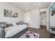 Bright bedroom with closet, modern decor, and a comfortable bed at 3482 E 143Rd Dr, Thornton, CO 80602