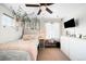 Bright bedroom featuring a ceiling fan, ample natural light, and stylish decor at 14454 Grape Way, Brighton, CO 80602