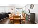 Spacious dining room featuring a large wooden table and chairs plus bright windows at 14454 Grape Way, Brighton, CO 80602