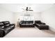 Spacious living room with ceiling fan, neutral carpet and lots of space for entertaining at 14454 Grape Way, Brighton, CO 80602