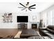 Bright living room with a fireplace, flat screen tv and comfortable seating at 14454 Grape Way, Brighton, CO 80602